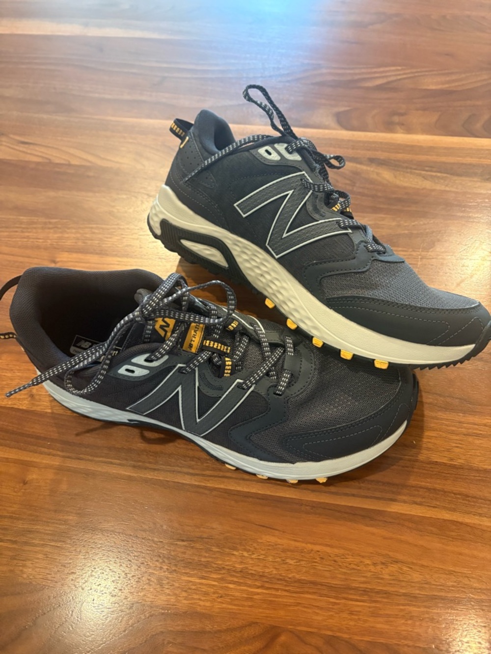 New Balance Men's Black and White Trail Sneakers with Yellow Accents